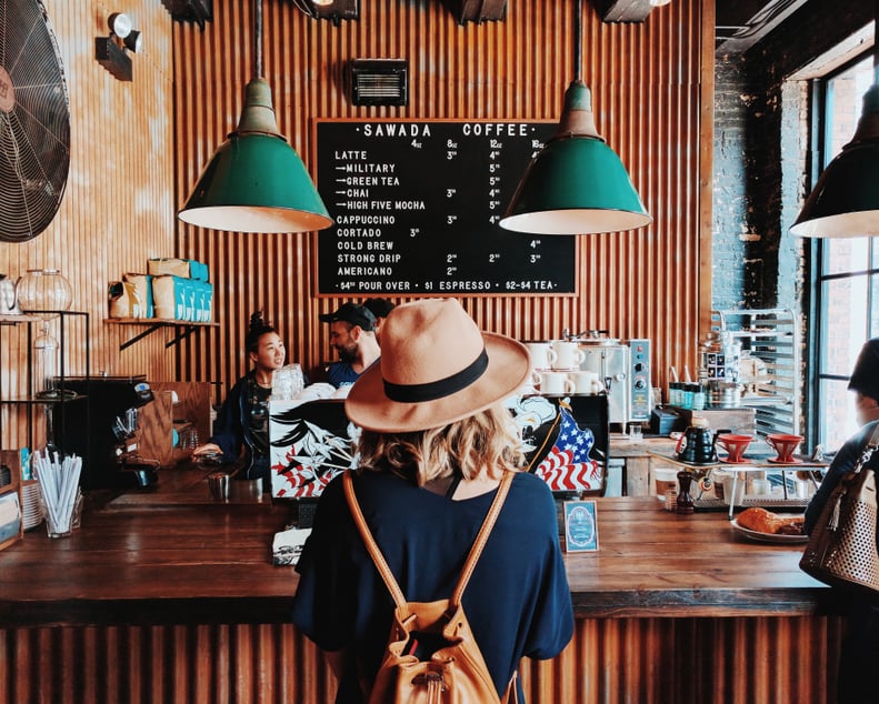 Buy coffee for the next person in line.