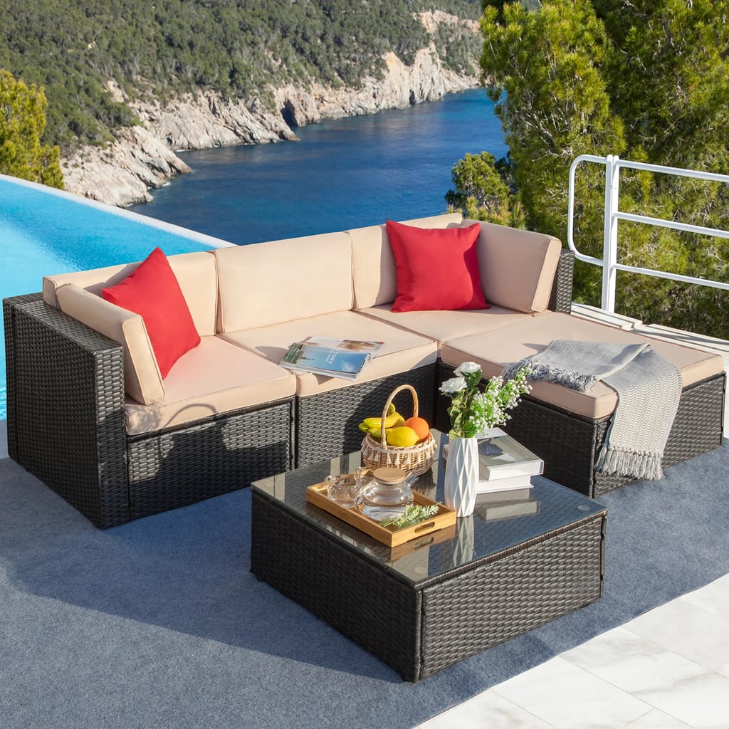 An Outdoor Sectional: Agaran Metal Seating Group With Cushions