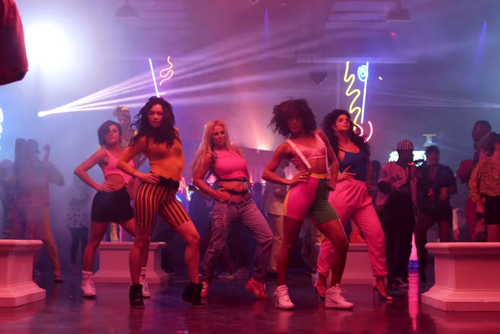 Obviously a dance break for Britney, in a crop top, jeans, and a Zana Bayne leather harness ($295) and belt.