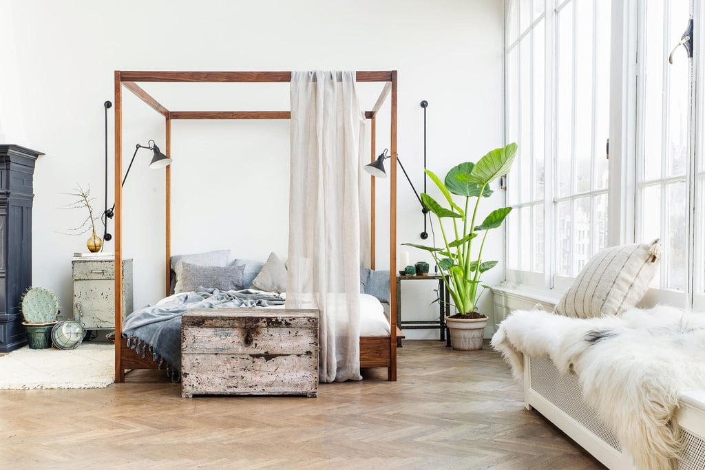 The mirror on the wall is certain that this airy, white bedroom is the fairest of all.