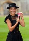 Tennis Star Emma Raducanu Receives MBE in Sheer Lace Dress and Wide-Brimmed Hat