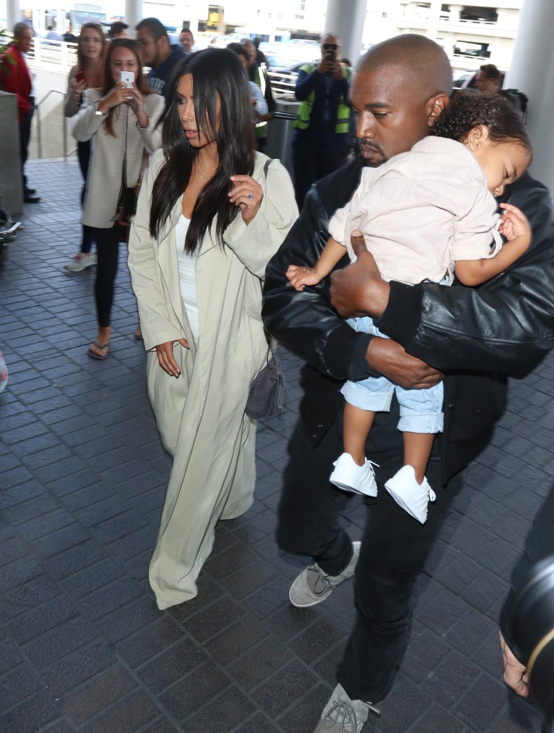 Meanwhile, Kim and Kanye contrasted in all-black and all-white outfits.