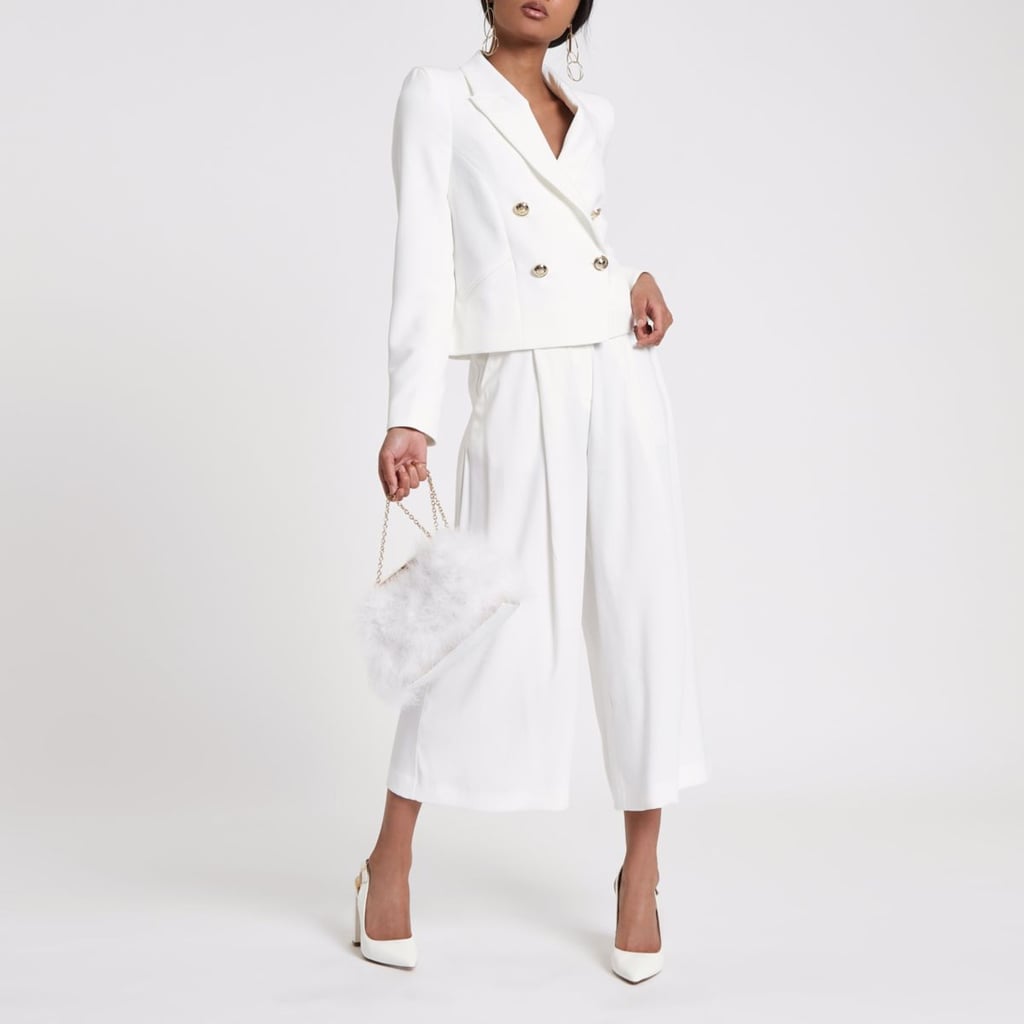 Pair this River Island White Crop Double Breasted Tux Blazer ($130) with a glamorous skirt or keep it simple with matching trousers.