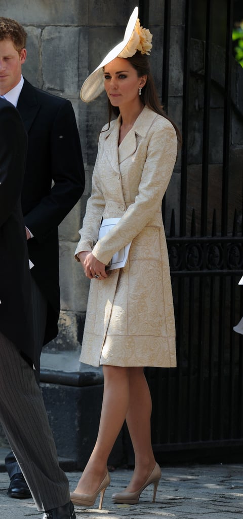 Kate Middleton was one sophisticated wedding guest in a printed coat and matching hat when Zara Phillips got married in Edinburgh in July 2011. To mimic Kate's style, top your wedding attire with a statement coat for the ceremony; then take it off for the reception.