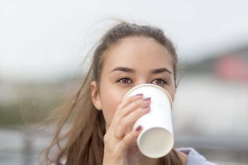 Woman Drinking Coffee - Why Does Coffee Make People Poop?