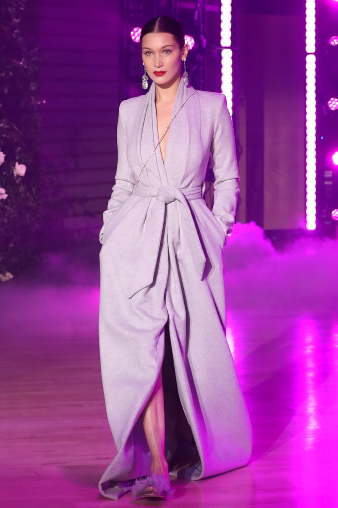Walking in Brandon Maxwell's show wearing a lavender robe by the designer.