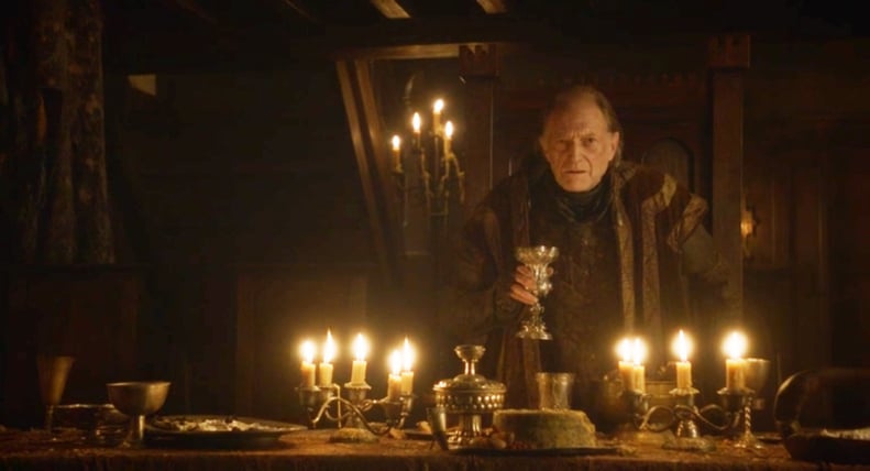 Walder holding a golden chalice while making a speech at the Red Wedding