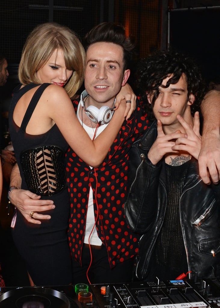 Taylor held on to Nick just long enough to make us forget she was rumored to be dating Matt Healy, who's on the far right.