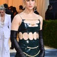Tommy Dorfman Rocks Rubber Cutout Gown and "Protect Trans Kids" Bag at the Met Gala
