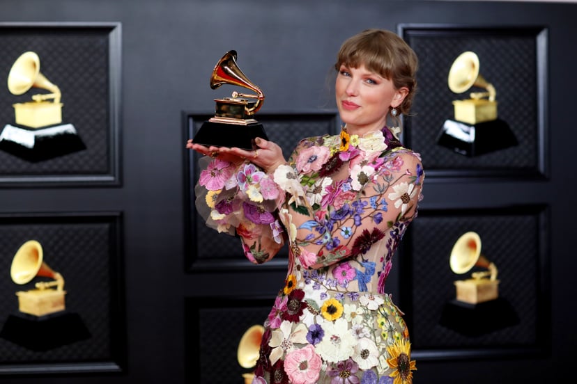 Los Angeles, CA - March 14: Taylor Swift with her Grammy on the red carpet at the 63rd Annual Grammy Awards, at the Los Angeles Convention Center, in downtown Los Angeles, CA, Sunday, Mar. 14, 2021. (Jay L. Clendenin / Los Angeles Times via Getty Images)