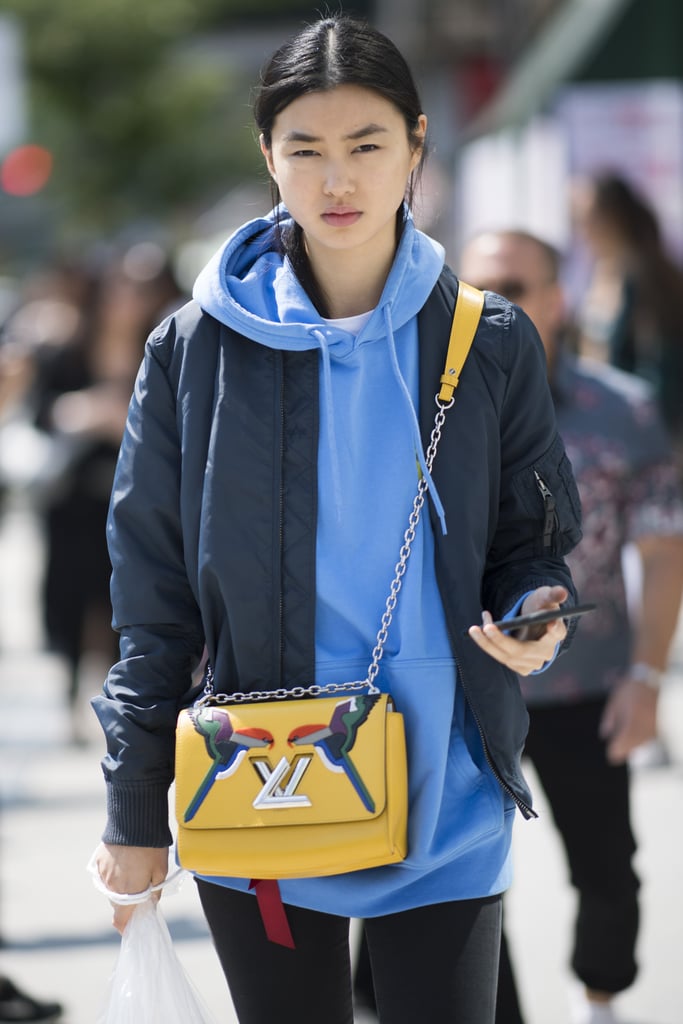 Paired with a hoodie, bomber, and statement bag, all in a complementary color scheme.
