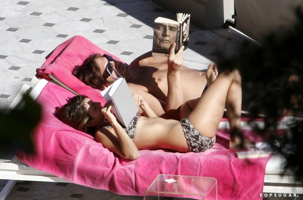 The couple got a bit of sun while reading together during a vacation in Nice in March 2008.