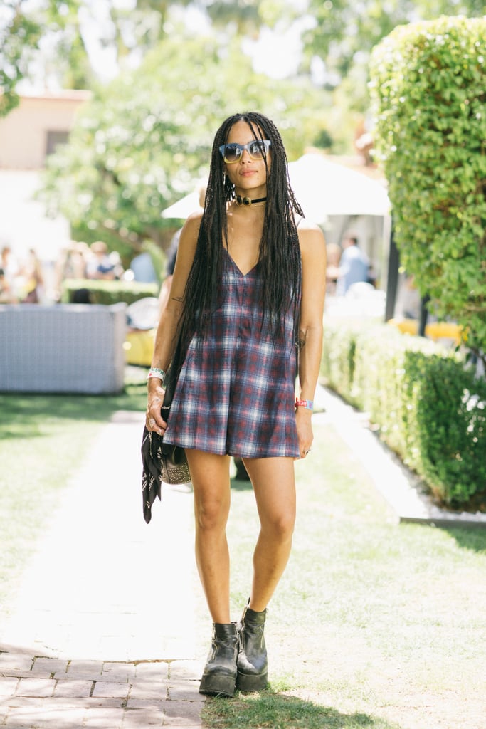 Zoe Kravitz played up the colors of her lightweight plaid dress with two-tone Marc by Marc Jacobs sunglasses. She balanced her look with black edgy boots.