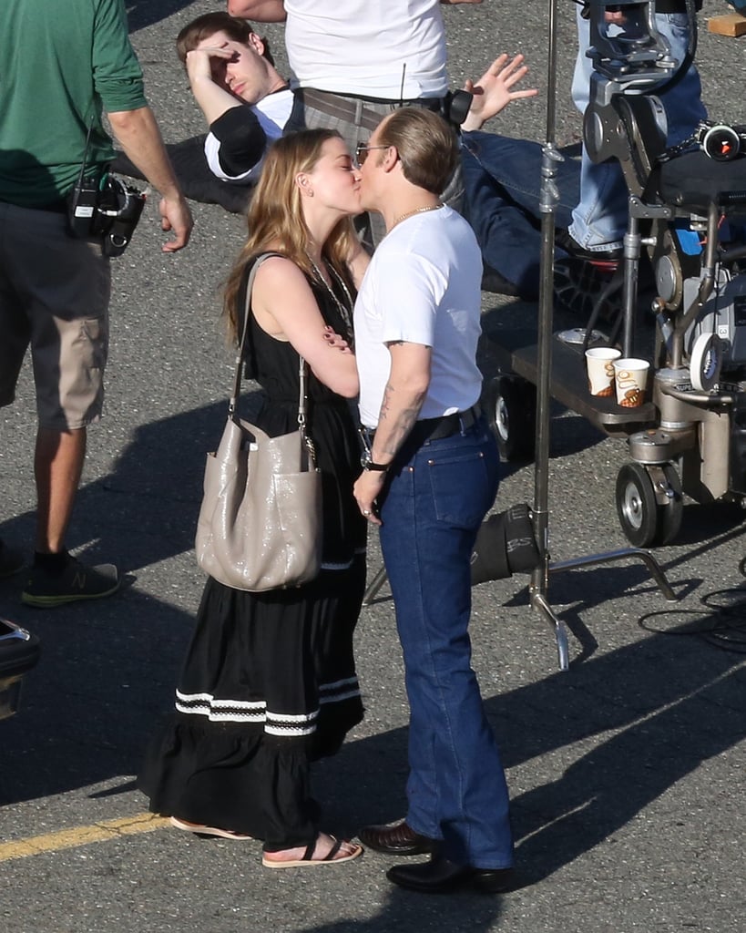 Johnny Depp and Amber Heard shared a sweet kiss when the actress visited her husband-to-be on the set of his latest film, Black Mass, near Boston on Monday. Johnny looked almost unrecognizable on set as he was given a dramatic makeover to play real-life Boston gangster Whitey Bulger. While Johnny lost his trademark hairstyle for the role, it didn't look like Amber minded, as she hung around the actor on set while he prepared to film a violent scene. Johnny and Amber got engaged in January after dating for nearly two years. The pair met on the set of The Rum Diary but didn't spark up a real romance until after filming. There's no word on when the couple will officially get hitched, but both of the stars have a very busy schedule ahead of them as Johnny is set to star as Harry Houdini in The Secret Life of Houdini, and Amber is currently working on both When I Live My Life Over Again and The Adderall Diaries.
