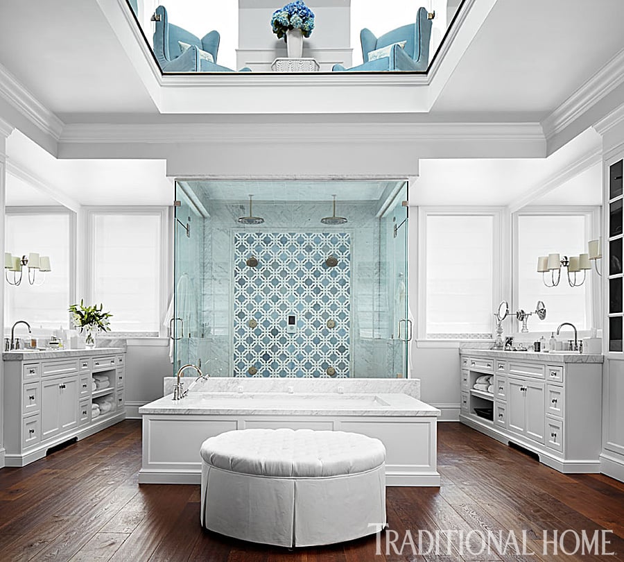 Giuliana and Bill have a two-story bathroom and dressing room. The spaces are unified by teal Bernhardt chairs on the upper floor and matching Walker Zanger tiles below.
