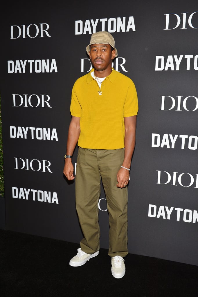 During an event for Dior and Pusha T, Tyler wore a chic mustard-colored zip-up shirt with trousers and a beige bucket hat. Chic!