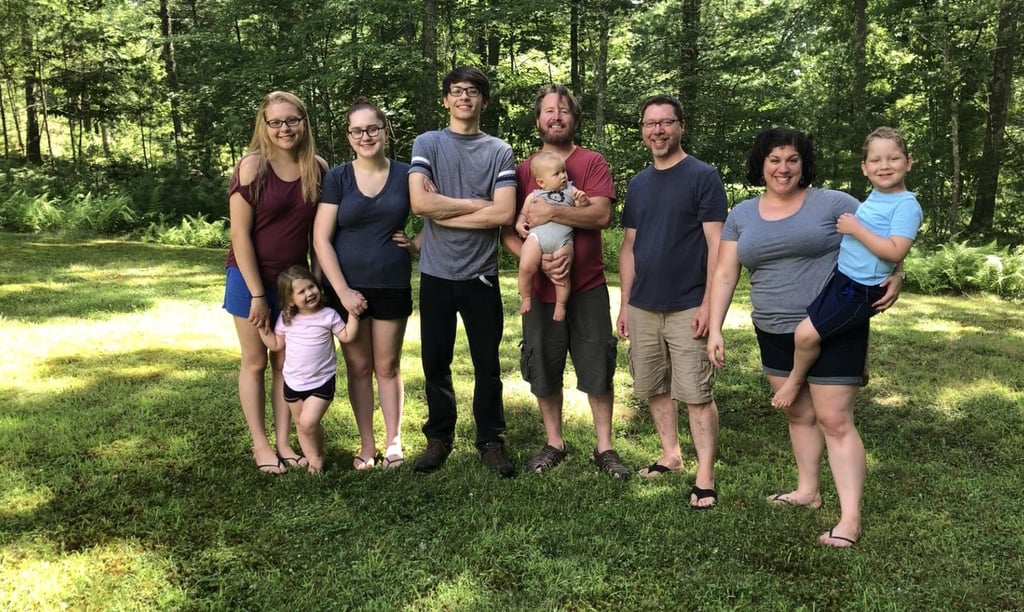 Lindsay Taylor, a 33-year-old mom of four and stepmom to two kiddos, has quite the setup when it comes to her living situation. She shares a home with both her ex-husband, Chris, and current husband Mike, along with all six children — and together, they make up the Taylor/Kelley family. And if Lindsay could be perfectly honest, she wouldn't have it any other way. 
After having her daughter Rachel at 16, Lindsay met Chris, got married, and had two adorable kids, Lucas and Joanna with him. But unfortunately, the marriage didn't last and the pair divorced. Eventually, Lindsay married Mike, who had 21-year-old daughter Destiny and 19-year-old son Danny from a previous marriage. And before they knew it, Lindsay and Mike were welcoming a son of their own named Harrison. 

    Related:

            
            
                                    
                            

            See How This Divorced Couple Live Together With Their New Partners and Combined 6 Kids
        
    
Lindsay told POPSUGAR that living away from Chris post-divorce was problematic from the beginning, and that's when the notion of moving everyone under one roof came up. 
"After Chris and I got divorced, I moved in with my mom in central Massachusetts for a few months," said Lindsay. "We didn't want the kids to move so I spent my days driving back and forth to be with them. Mike and I got an apartment together with his kids which was a little closer to my kids than where I was staying at my mother's, but it wasn't good enough." 
"It wouldn't be easy at first, in the long run it would be the best ideal situation for our kids to have both parents under one roof again."
After the apartment they were renting was suddenly foreclosed on, Lindsay knew she needed to have a serious conversation about their living situation with her ex-husband. 
"I sat down with Chris the next day and told him what was happening and we spoke about looking for a new place," she explained. "He was the one who suggested for all of us to move into his house in northeast Connecticut. He said that it wouldn't be easy at first, but in the long run it would be the best ideal situation for our kids to have both parents under one roof again."

    Related:

            
            
                                    
                            

            See How This Divorced Couple Live Together With Their New Partners and Combined 6 Kids