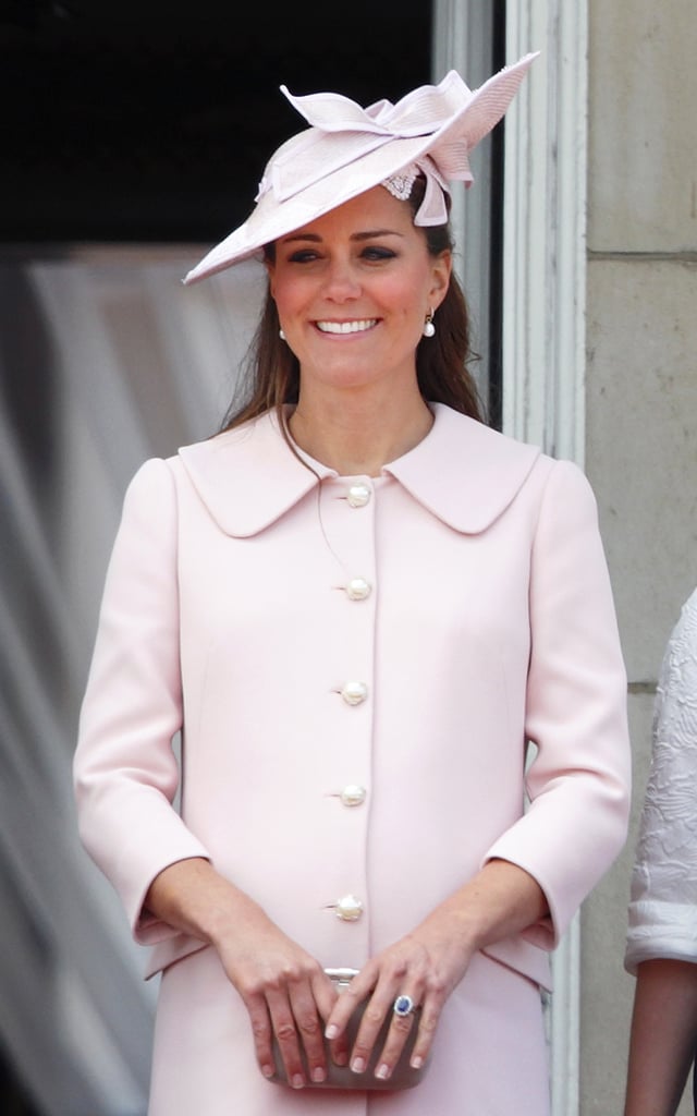 In her final public appearance before maternity leave, Kate's blowout was tucked securely under a pink hat.