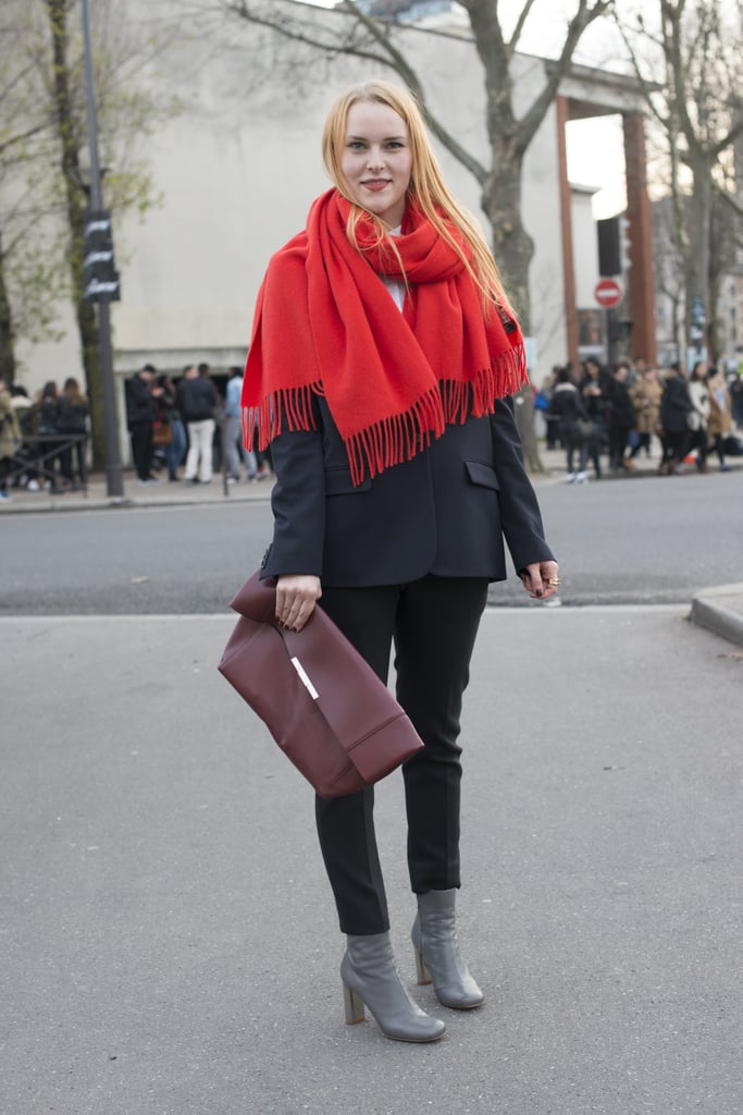 You hardly notice the suiting underneath the oversize scarf and beside the clutch.