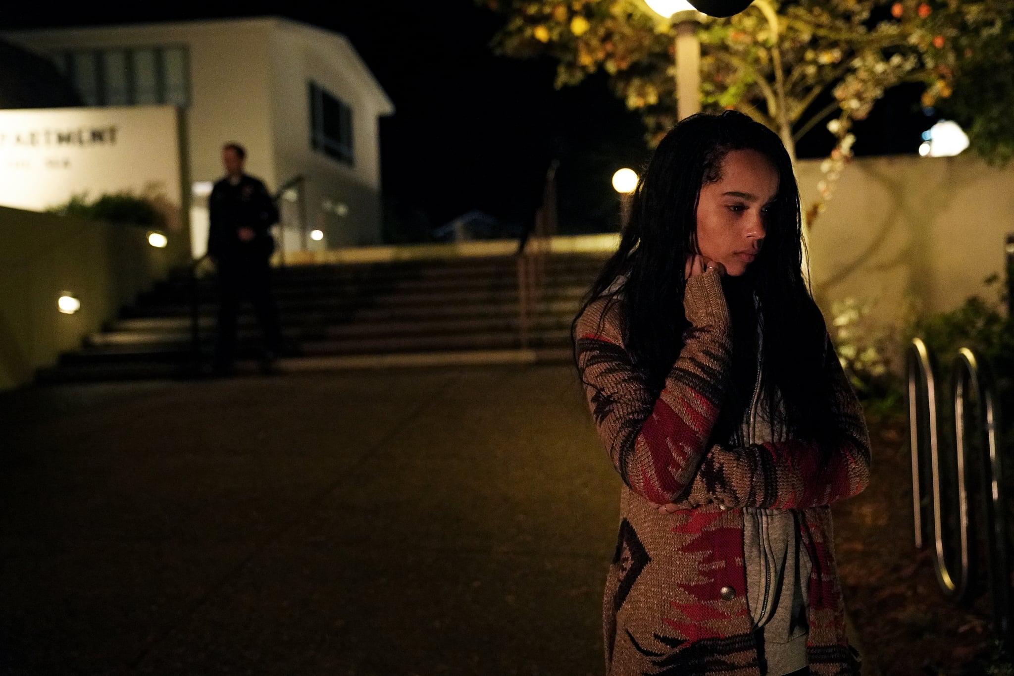 Zo Kravitz as Bonnie Carlson in a graphic cardigan and zip up