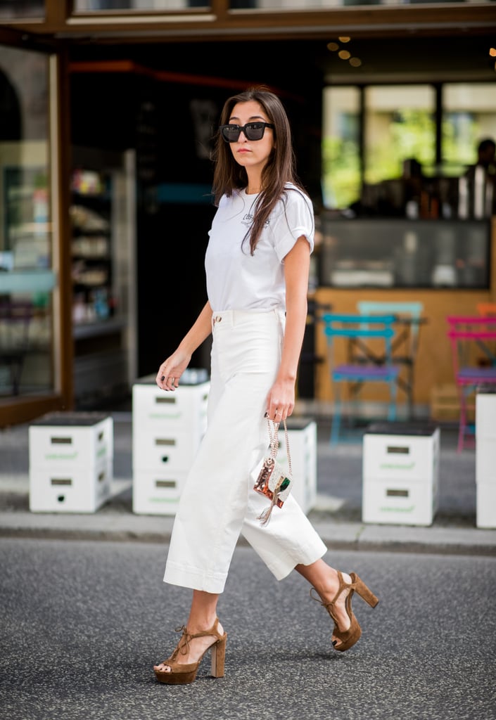 Nail head-to-toe white with a simple tee and cropped pants.