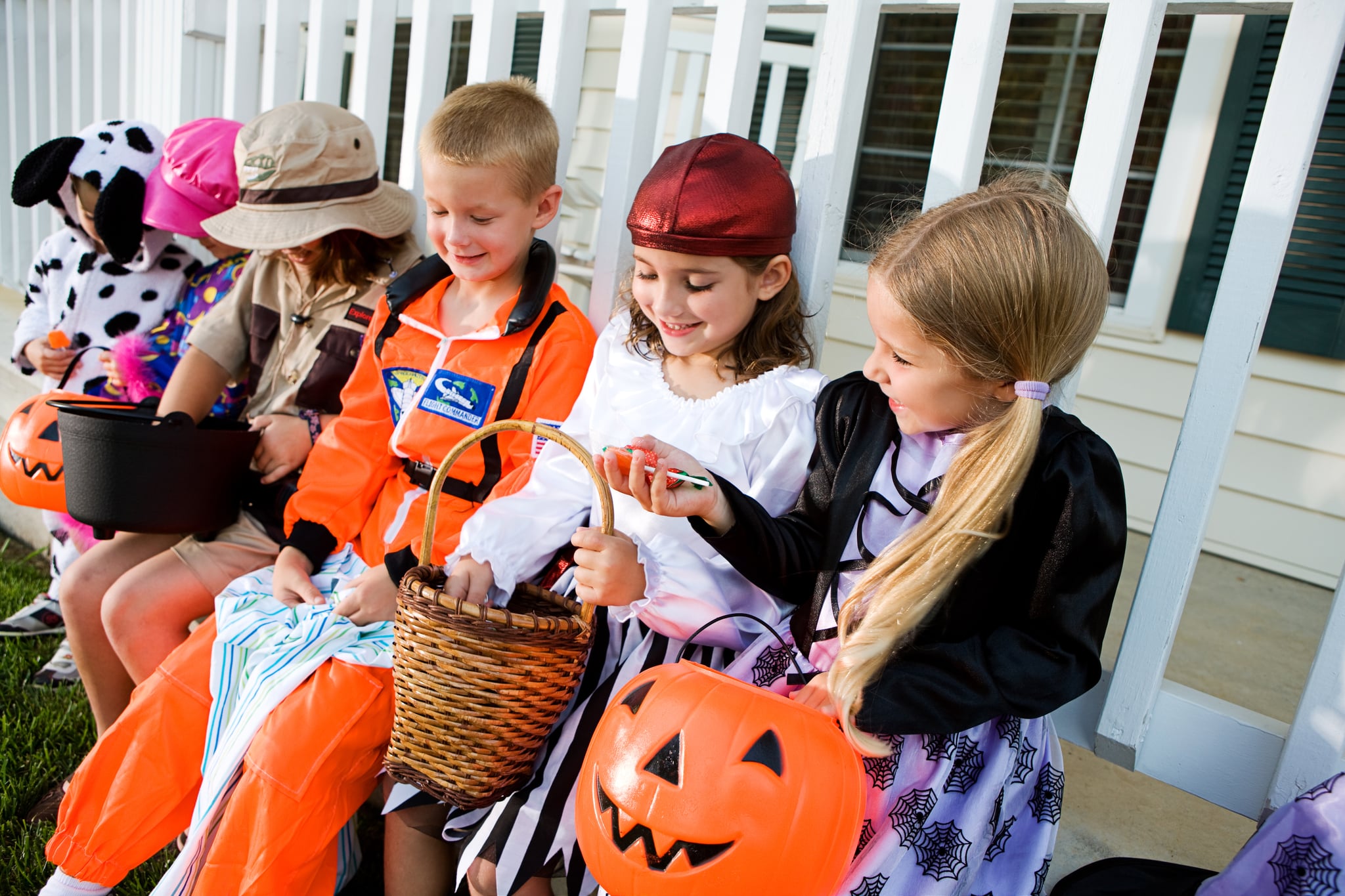 Family trick or treating on a street