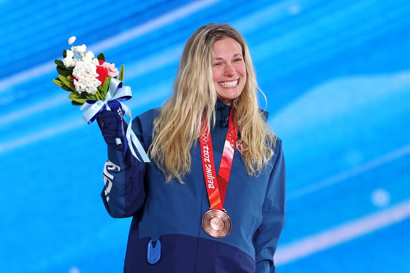 ZHANGJIAKOU, CHINA - FEBRUARY 09: Bronze medallist, Jessie Diggins of Team United States celebrates on the podium during the Women's Cross-Country Sprint Free medal ceremony on Day 5 of the Beijing 2022 Winter Olympic Games at Zhangjiakou Medal Plaza on F