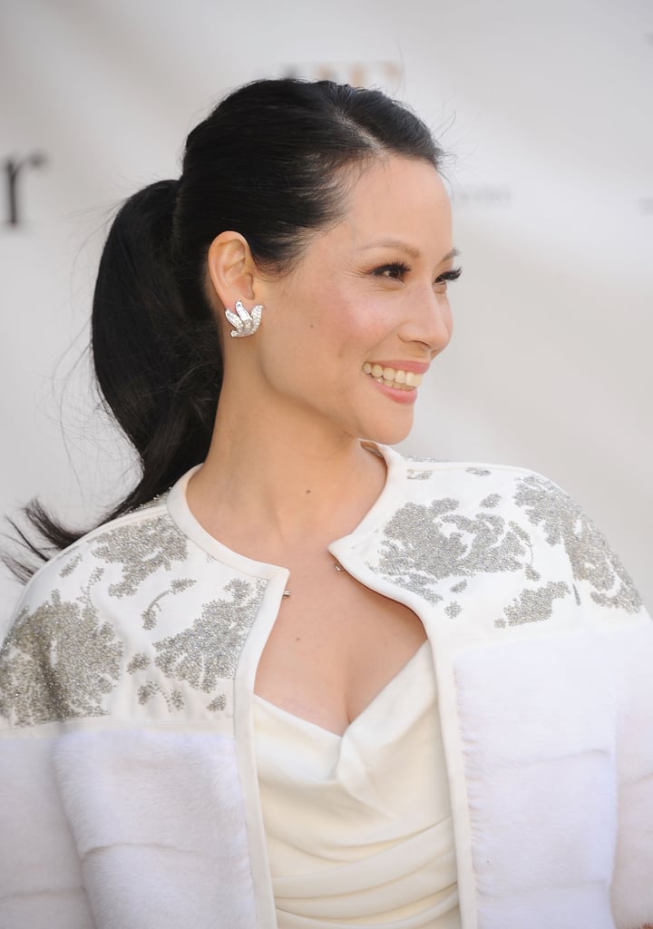 Yes, you can wear a ponytail to a nighttime event. Lucy Liu's sleek look with upturned ends can work for any after-5 affair.