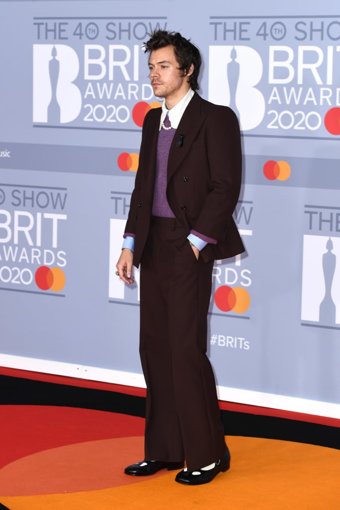 Attending the 2020 Brit Awards wearing a Gucci suit with a pearl necklace and Mary Janes.