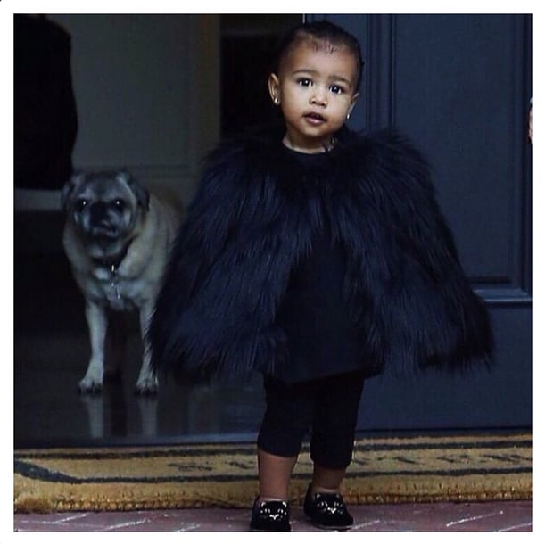 North West Wearing Fur Coat and Charlotte Olympia Cat Flats