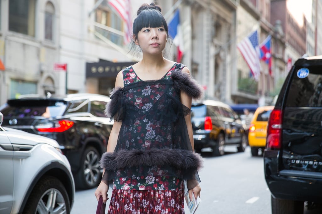 Fall is the perfect time to cut a fringe, since humidity starts to plummet. Style blogger Susie Bubble showed how chic bangs look with a polished ballerina bun and a few loose strands around your ears.