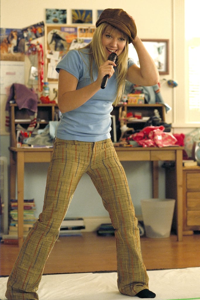 Showing off her singing chops in a blue tee and checkered pants. We love that she threw on a newsboy cap for a touch of drama.