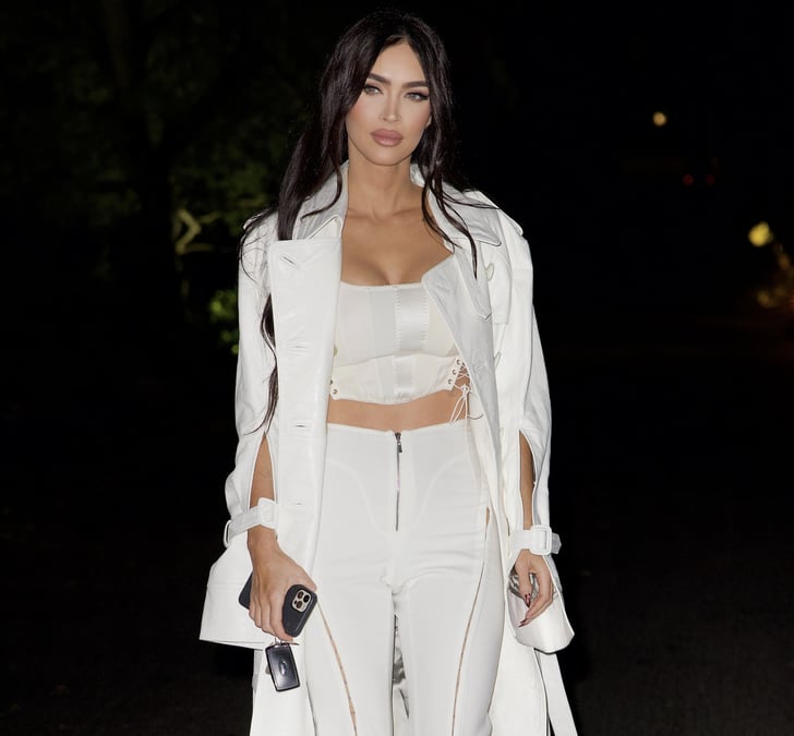 Megan Fox Wears a White Corset, Flare Pants, and Trench Coat