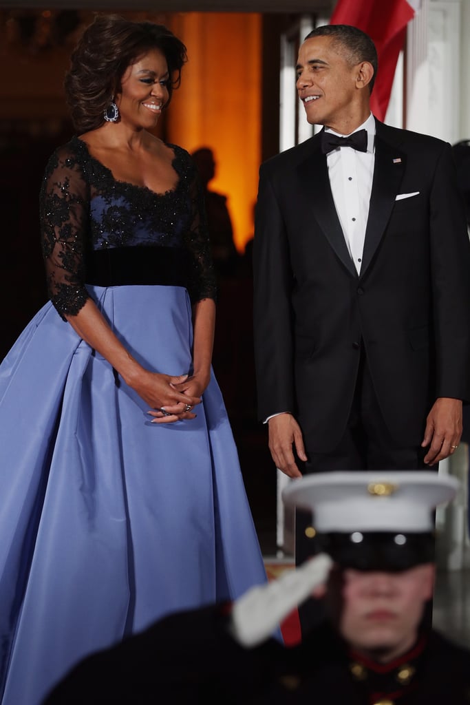 First Lady Michelle Obama stunned alongside President Obama, who also looked dapper as the pair welcomed French President Francois Hollande in February.