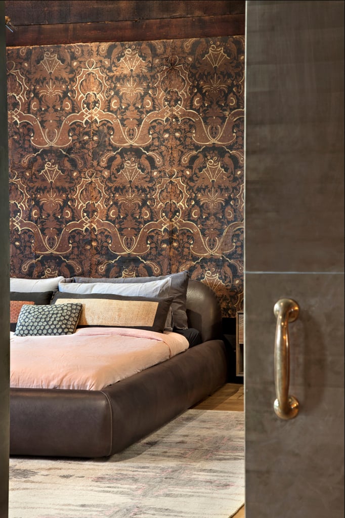 We love the bedroom's dark and moody color palette.