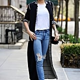 We love the interior detail of Miranda's full-length cardigan. With a mini Chanel box-clutch, ballet flats, and distressed jeans, this outfit makes for casual weekend wear at its finest.
