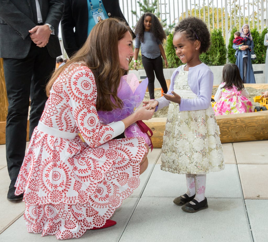 Kate looked completely smitten by this little girl during a visit to the Immigrant Services Society in Vancouver, Canada in September 2016.