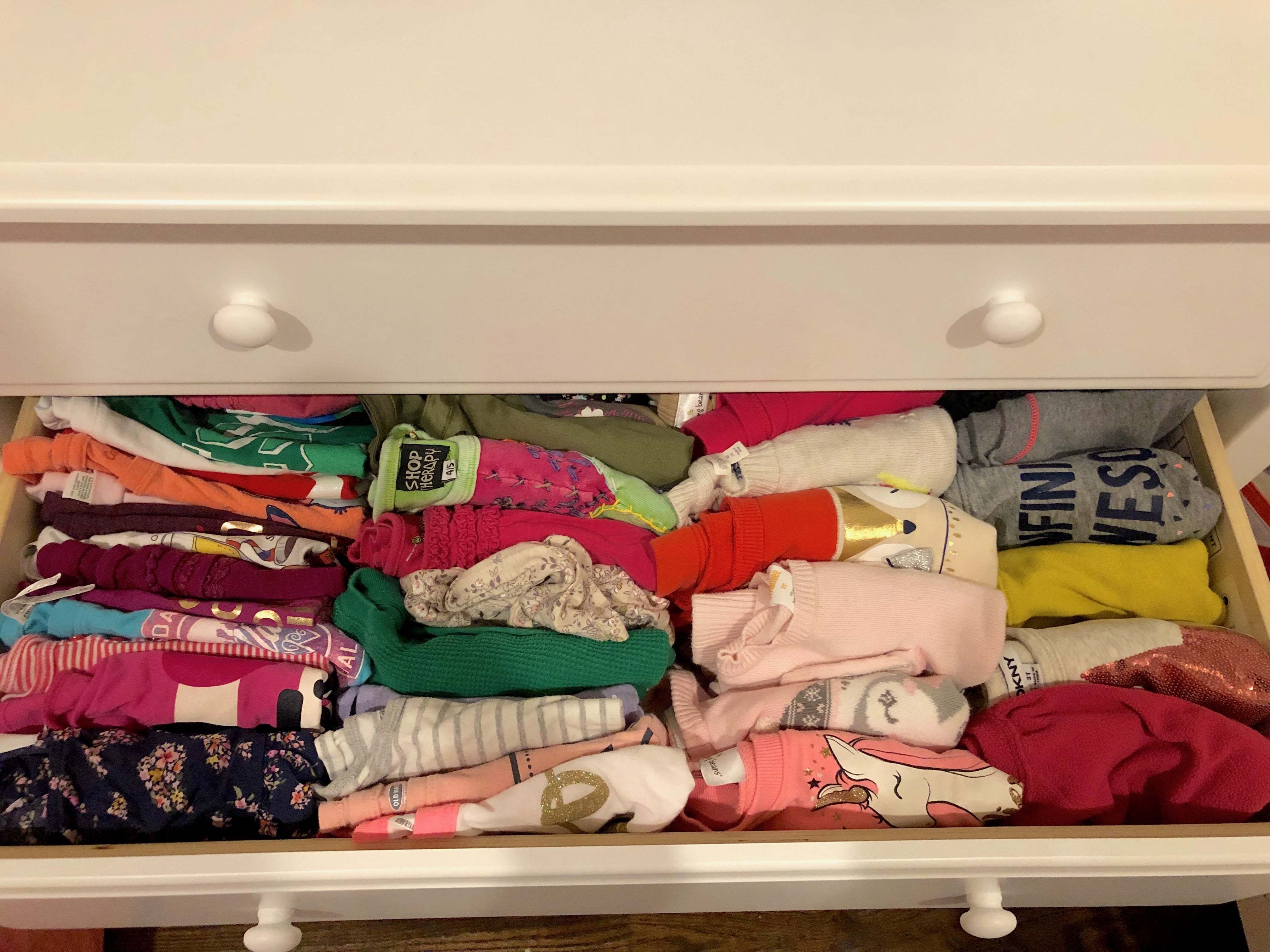 Marie kondo sweaters on shelves store