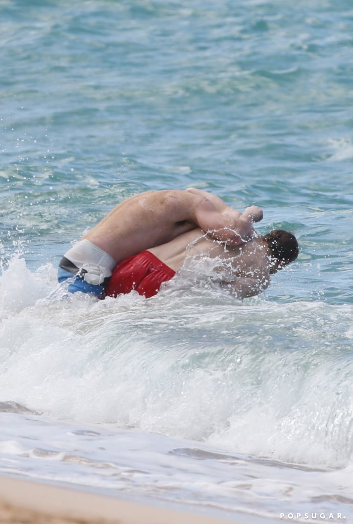 Charlie Hunnam and Garrett Hedlund Wrestle in Hawaii Photos