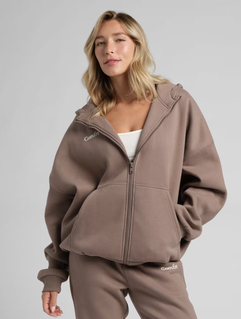 Comfrt Cloud Zip Hoodie ($49, originally $130)
Everyone needs an oversize hoodie in their closet, especially a cozy zip-up. The design lets you easily customize the ultra-soft cotton layer and has split kangaroo pockets for added convenience. With 20 different colorways to choose from, you can find the perfect shade to match all your favorite loungewear.