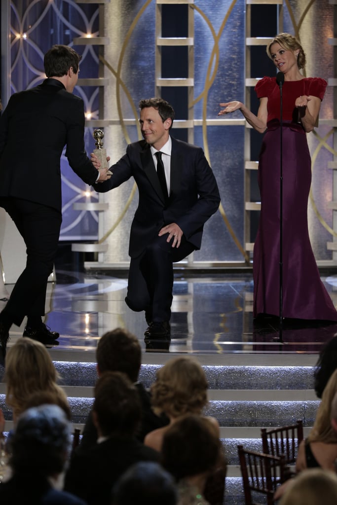 Seth Meyers bowed to Andy Samberg while presenting his Golden Globe.