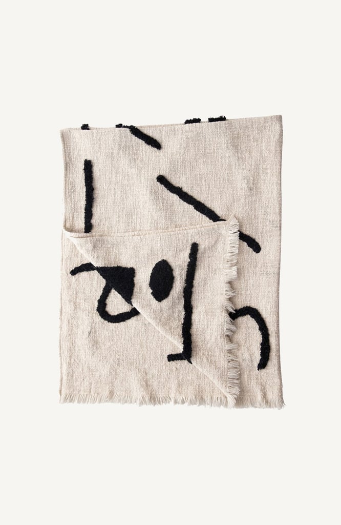 A Cozy Throw: Effortless Composition Black and Cream Abstract Throw