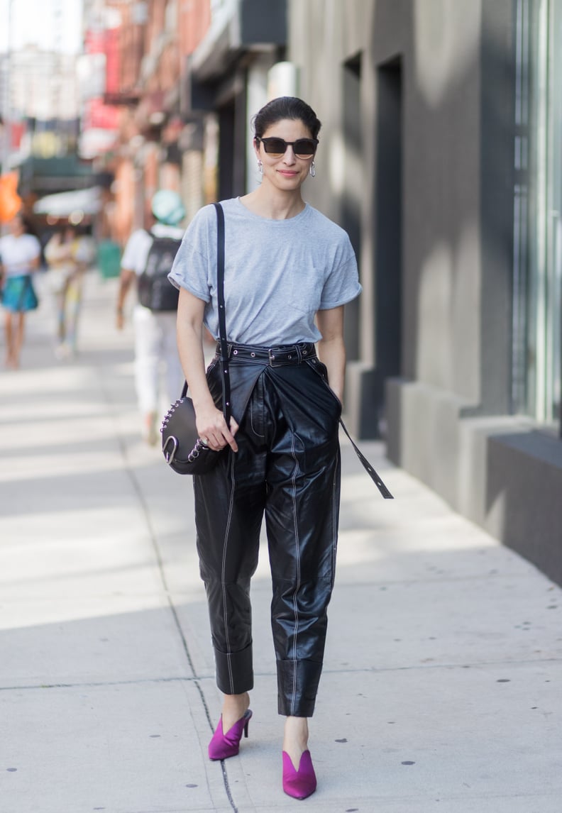 Caroline Issa Was Seen Wearing a Gray Shirt Tucked Into a Pair of High-Waisted Leather Trousers