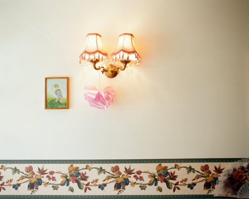 Living room with photo hanging on the wall with a lamp and bow tie