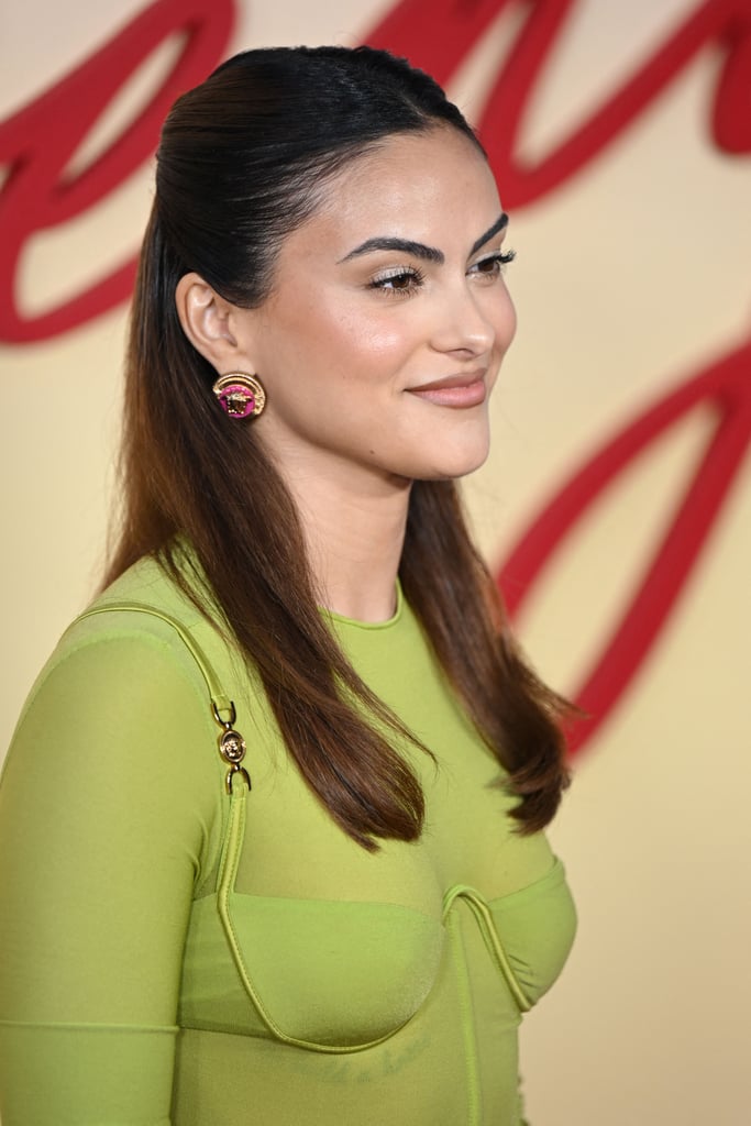 Camila Mendes Wears Green Versace Corset Top, Low-Rise Skirt