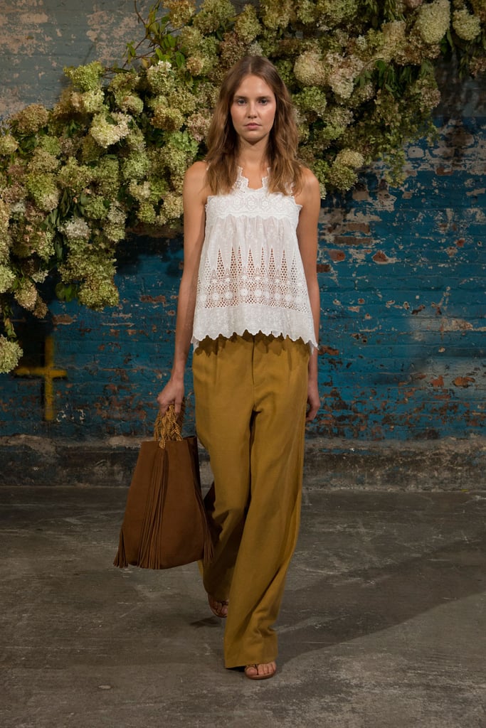 A lacy top and understated trousers.