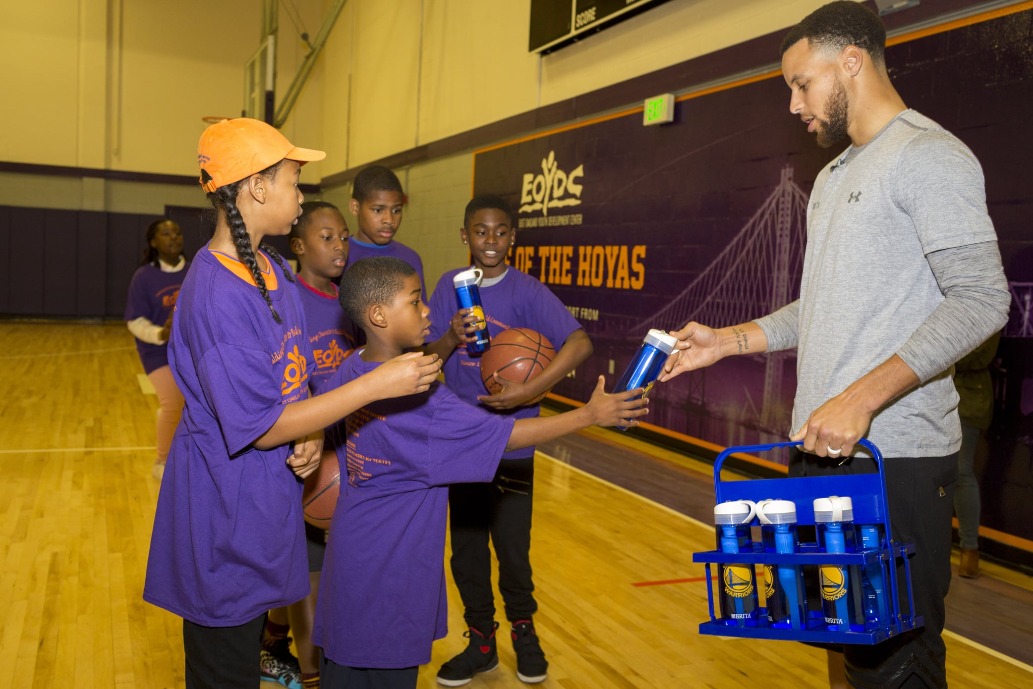 At an event announcing the Filter for the Future Grant Program, an effort to help schools limit bottled water waste,  superstar Stephen Curry handed out water to children playing a pick-up game at the East Oakland Youth Development Center Friday, March 30, 2018 in Oakland, Calif. (Eric Kayne/AP Images for Brita-Filter)