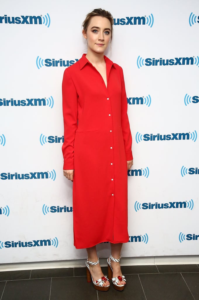 Wearing a red shirt dress with a pair of bejeweled heels.