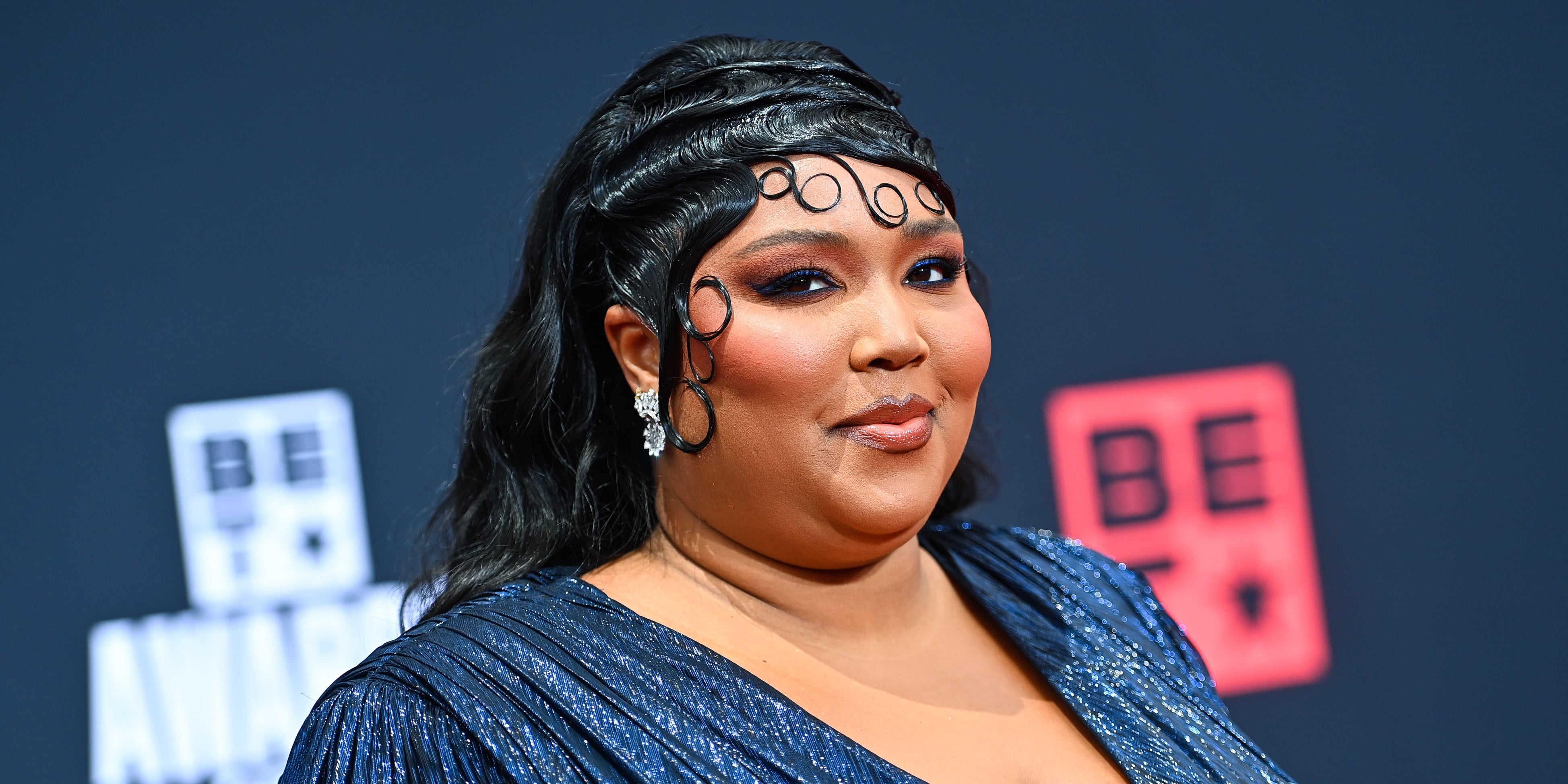 Lizzo wears cut-out leggings from shapewear brand Yitty on private