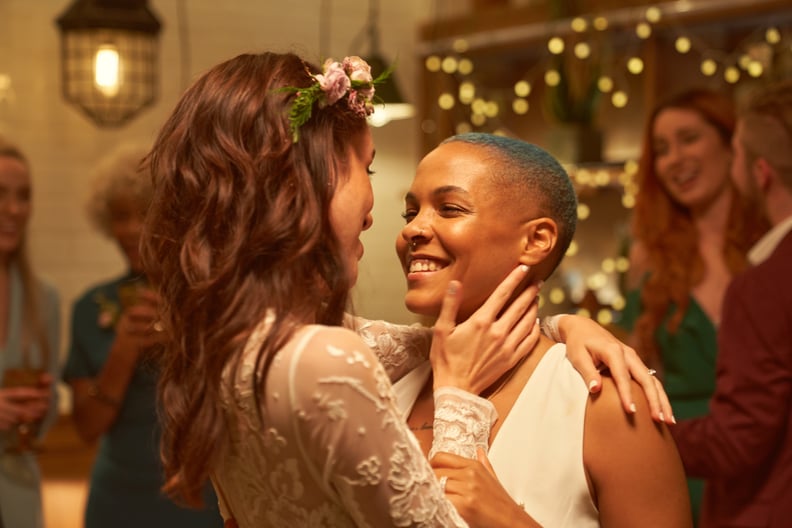 Two just married lesbians have their first dance at the wedding party
